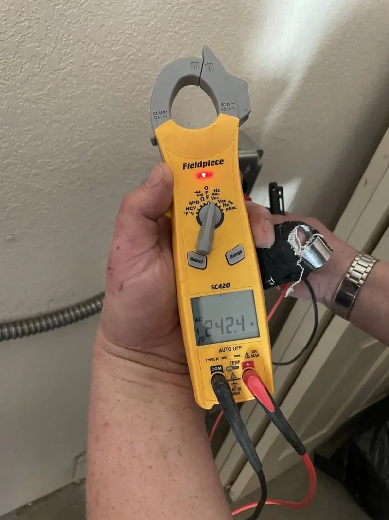 Voltage testing with clamp meter during Outlet Installation in Apex